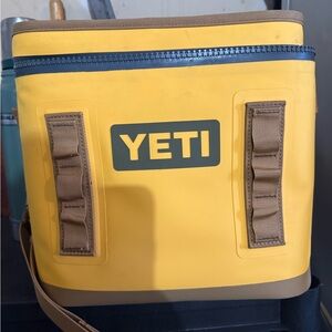 Yeti Yellow Cooler Bag with Tan Accents and Blue Zipper

Flip 12